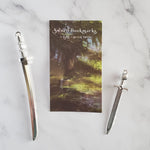 Load image into Gallery viewer, Metal Sword Bookmarks from The Fae of Bitter Thorn series
